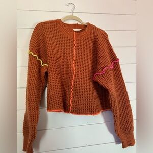 Vibrant Orange Sweater with Neon Details